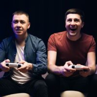 Two young guys playing video games