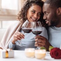 couple with wine on 6th year anniversary