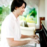 young man playing piano